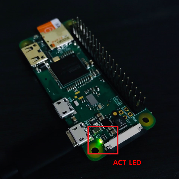 a picture of the Raspberry Pi Zero with the green Active LED lit and highlighted